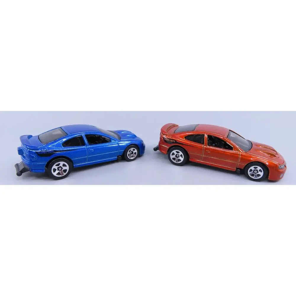 Hot Wheels PONTIAC '06 GTO LOT of 2 Factory Fresh Orange and Blue 1:64 Loose
